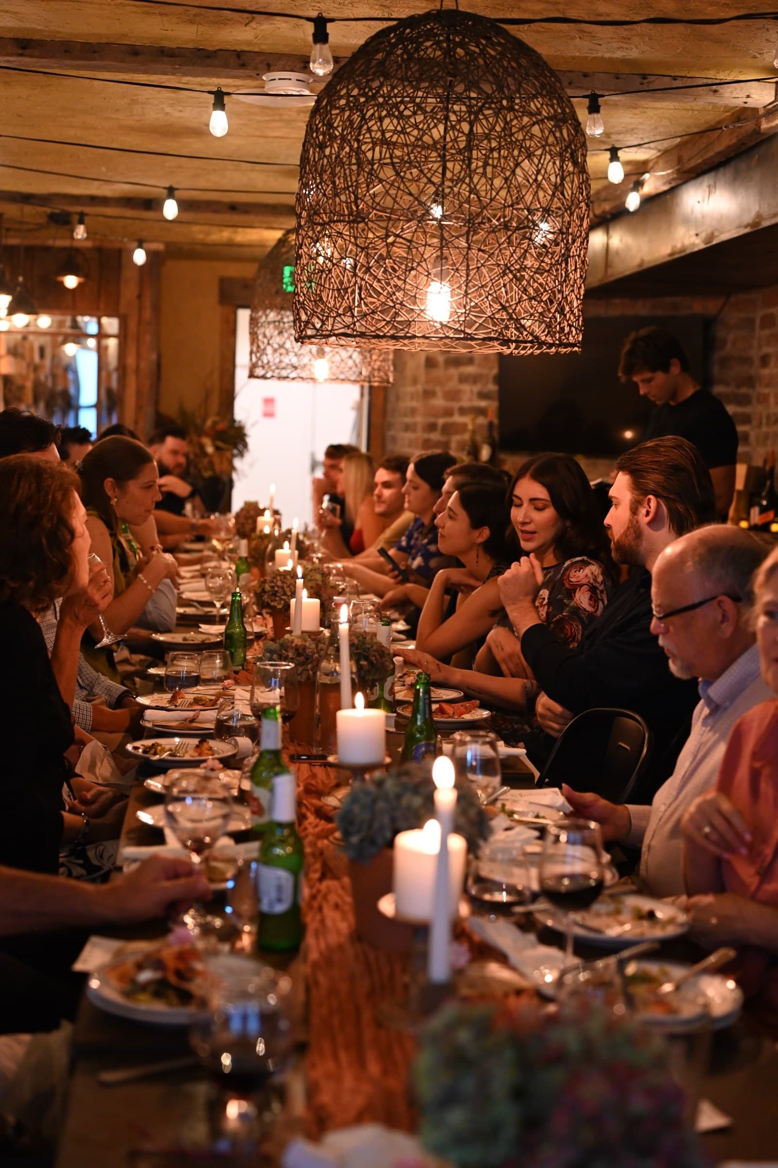 A long table, by candlelight.